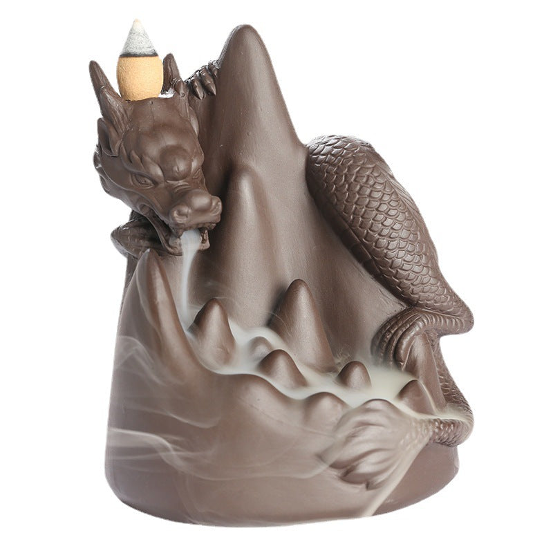 This handmade Purple Sand Dragon Backflow Incense Burner is the perfect addition to any room. With its intricate design and durable construction, you'll be enchanted by the mystical smoke that cascades down the figure.
