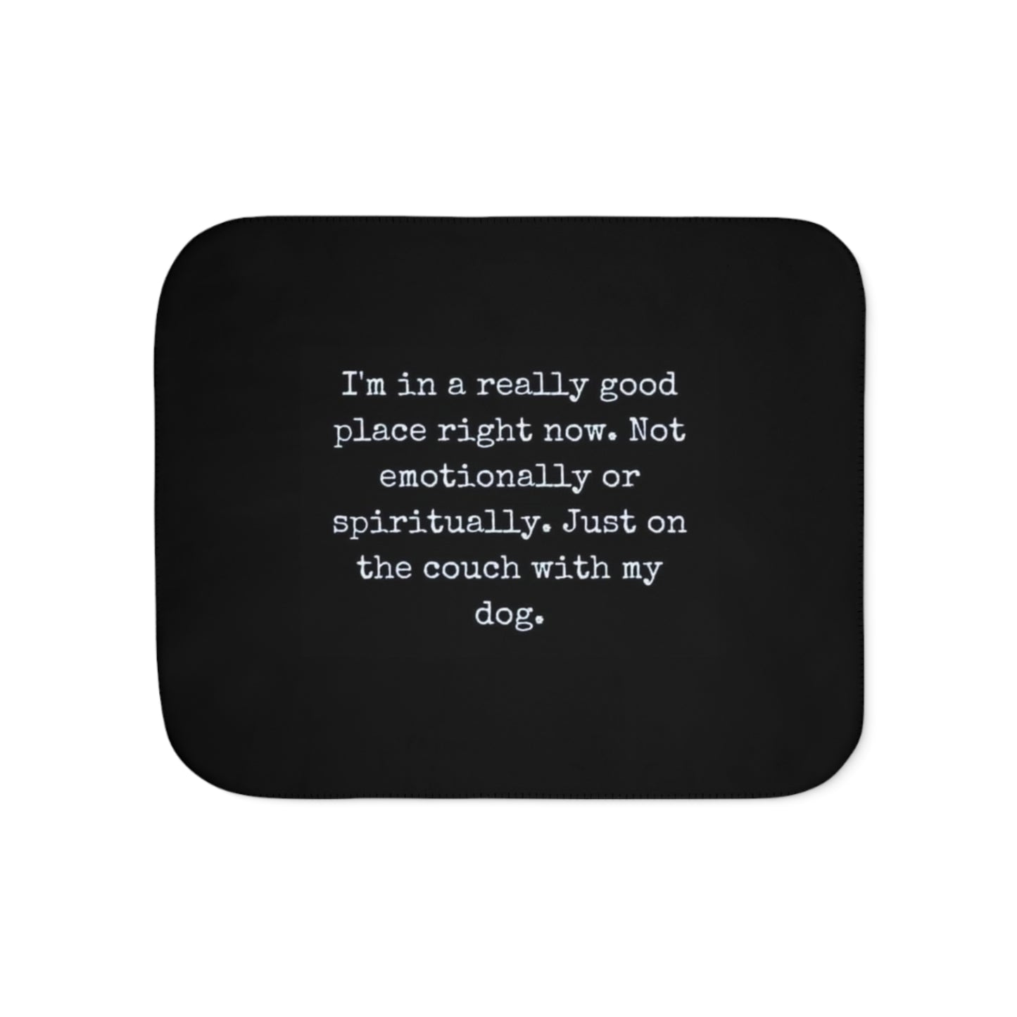Black mouse pad with white text on a white background