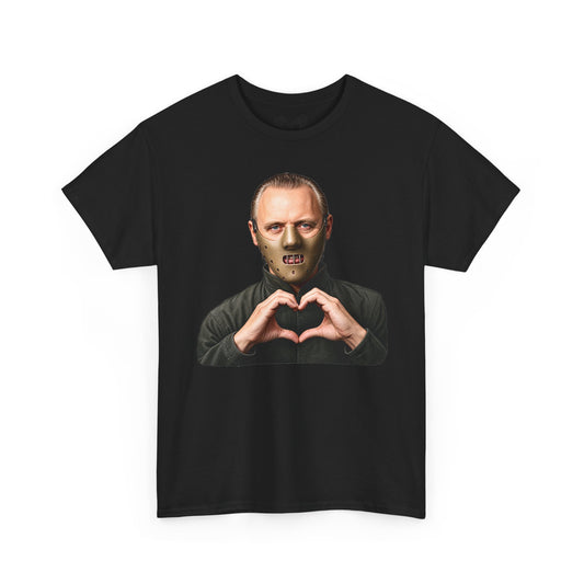 A black short-sleeve crewneck t-shirt featuring a graphic print of a man wearing a metallic zombie mask and making a heart shape with his hands, displayed on a solid white background.
