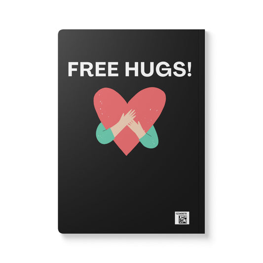 Notebook with 'FREE HUGS!' text and heart design on a black background