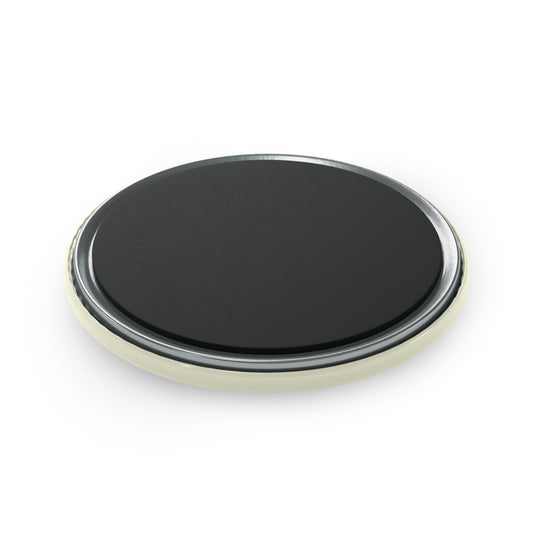 Round black object with metallic rim on a white background