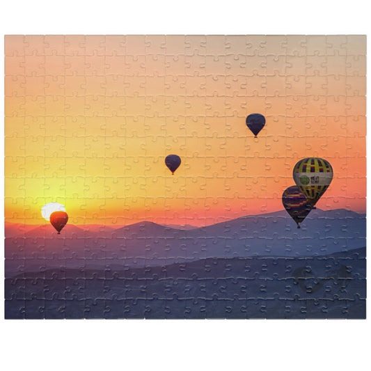 Embark on a journey through the sky with our Hot Air Balloons at Sunset Puzzle. With 110 to 1014 pieces, this puzzle will challenge your mind and soothe your soul. Take in the stunning artistry of the colorful hot air balloons against the dramatic sunset backdrop.