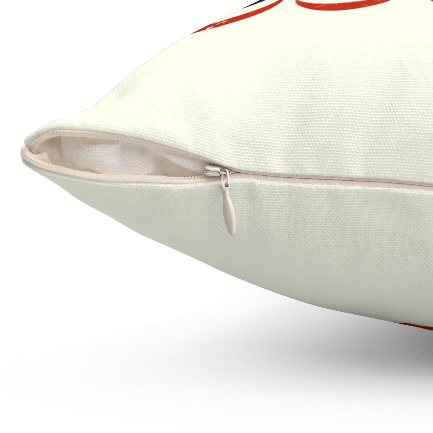 Close-up of a beige pillow with a zipper on a white background