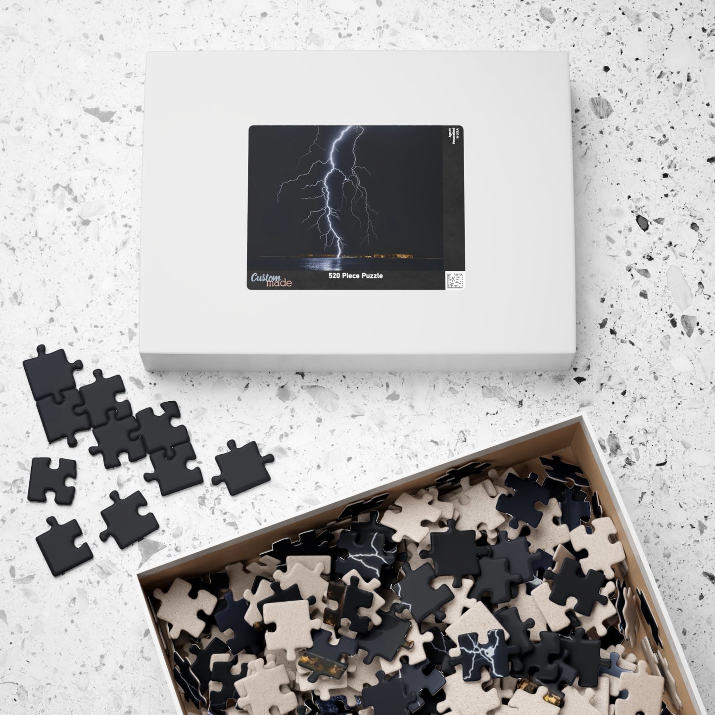 Experience the awe-inspiring beauty of nature with our Lightening Strikes Water Puzzle. This 110 to 1014 piece puzzle features a striking image of a lightning storm over a serene body of water. Challenge your mind and calm your soul with this captivating puzzle.