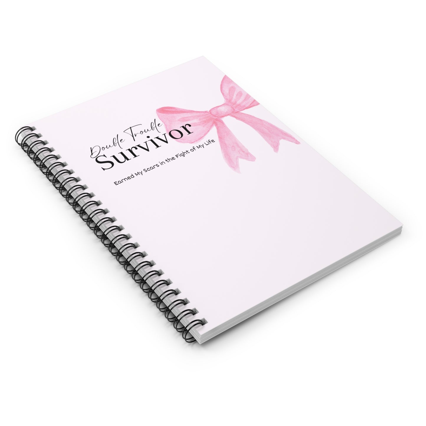 Notebook with a pink ribbon design and text on a white background