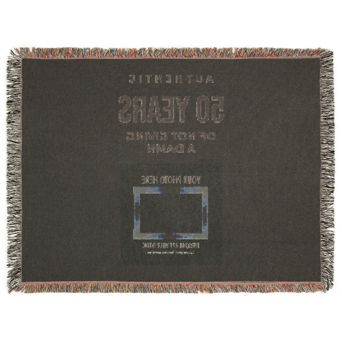 A square dark charcoal woven throw blanket with fringed edges, featuring placeholder text and a photo frame graphic on the front, shown against a plain white background.