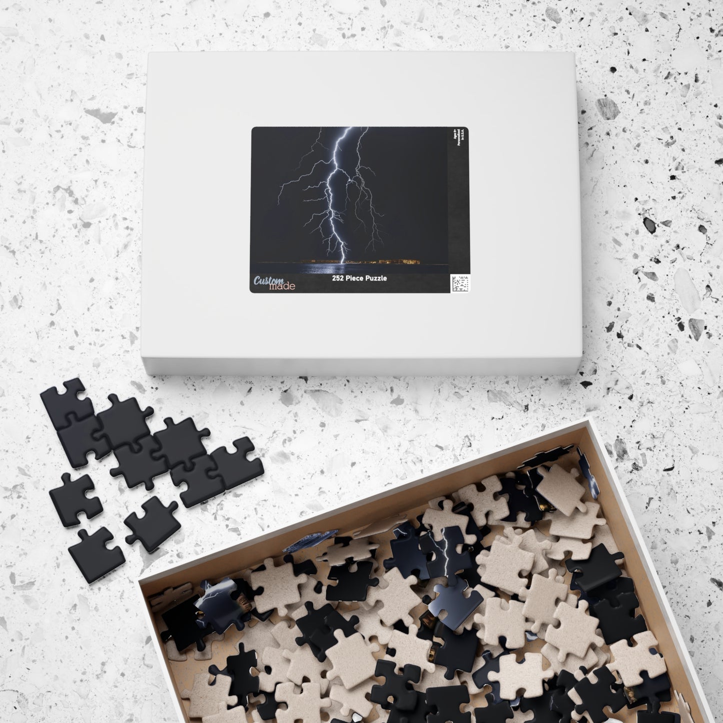 Experience the awe-inspiring beauty of nature with our Lightening Strikes Water Puzzle. This 110 to 1014 piece puzzle features a striking image of a lightning storm over a serene body of water. Challenge your mind and calm your soul with this captivating puzzle.