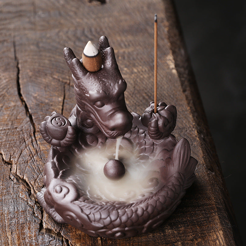 This beautiful Small Dragon Back Flow Incense Burner is a perfect addition to any home. Crafted with intricate details and made from durable material, this incense burner will create an enchanting atmosphere in any room.