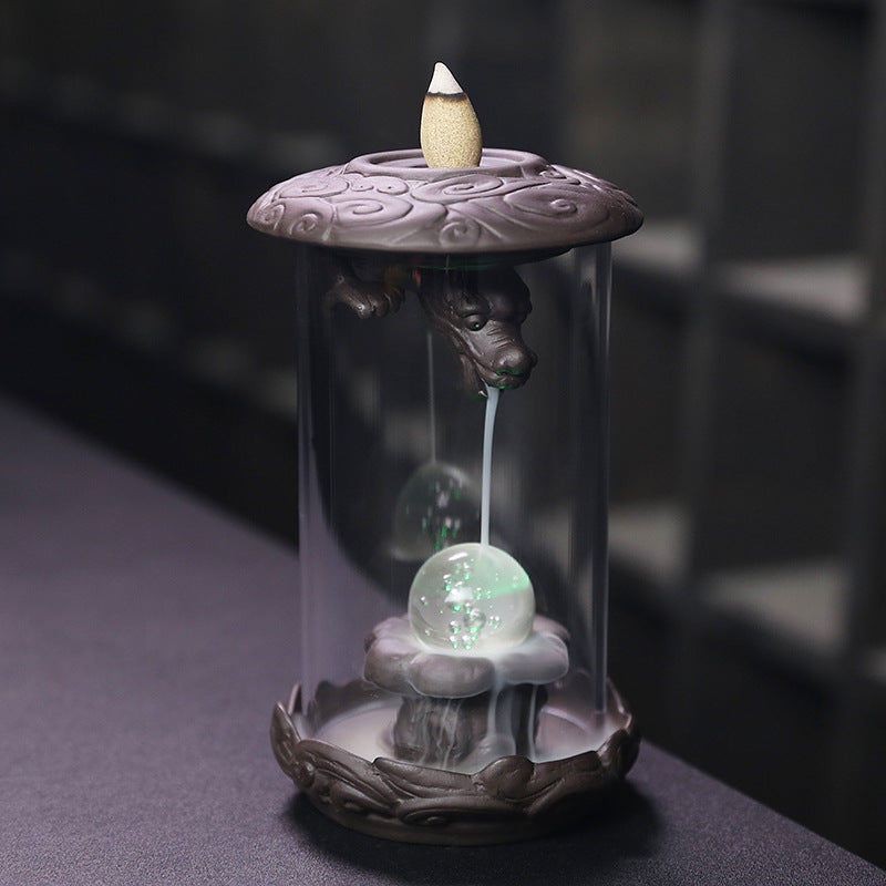 Upgrade your incense game with our Purple Sand Dragon Backflow Incense Burner. This beautiful burner features a unique design that releases a downward flow of smoke, creating a mesmerizing and relaxing ambiance. Perfect for meditation, yoga, or simply unwinding after a long day.