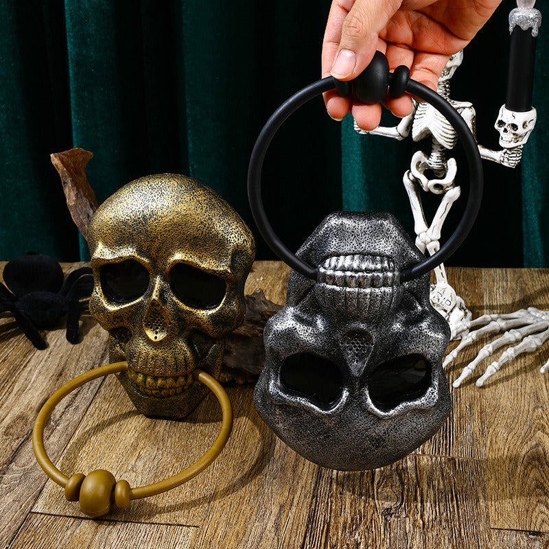 Make a bold statement this Halloween with the Halloween Skull Door Knocker. Crafted to catch attention, this striking decoration adds a spooky touch to your front door while serving as a functional knocker. Its detailed skull design creates an eerie atmosphere that sets the perfect mood for your Halloween festivities.