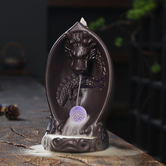 This Creative LED Lamp Backflow Dragon Incense Burner is a unique and eye-catching decoration for any space. Featuring a mesmerizing backflow smoke effect and LED lighting, this burner adds a touch of relaxation and ambiance to any room.