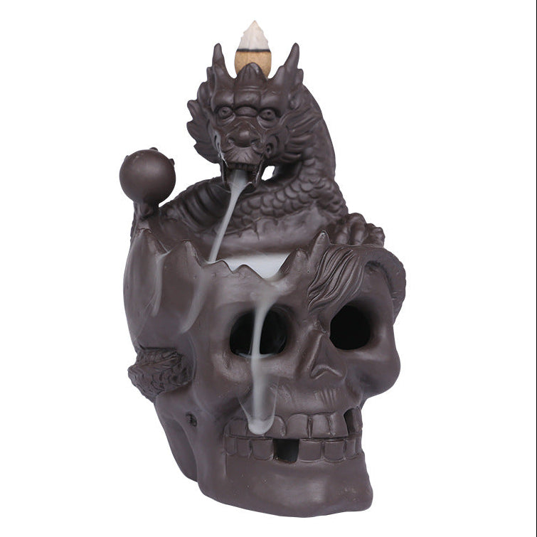 Elevate your space with the Aromatherapy Skull Dragon Backflow Incense Burner. This striking piece combines dramatic skull and dragon motifs to create a captivating focal point.