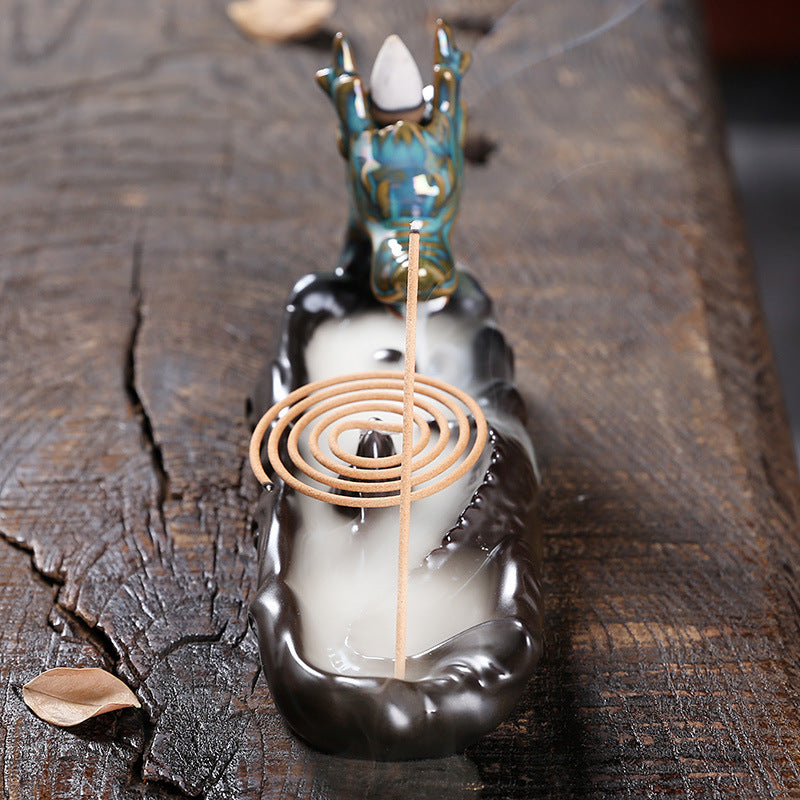 Experience the captivating aroma of burning incense with this stunning Ceramic Backflow Aromatherapy Dragon Incense Burner. Crafted from high-quality ceramic and featuring a majestic dragon design, this incense burner is the perfect way to enhance the atmosphere in any room.