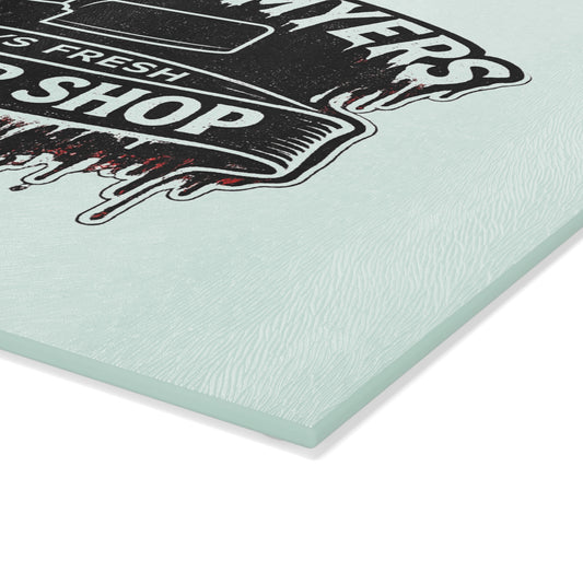 Bring a chilling touch of horror-inspired style to your kitchen with the Michael Myers Butcher Shop Glass Cutting Board. Designed for fans of classic slasher movies and spooky kitchen décor, this bold cutting board combines everyday functionality with a dark, Halloween-inspired aesthetic.