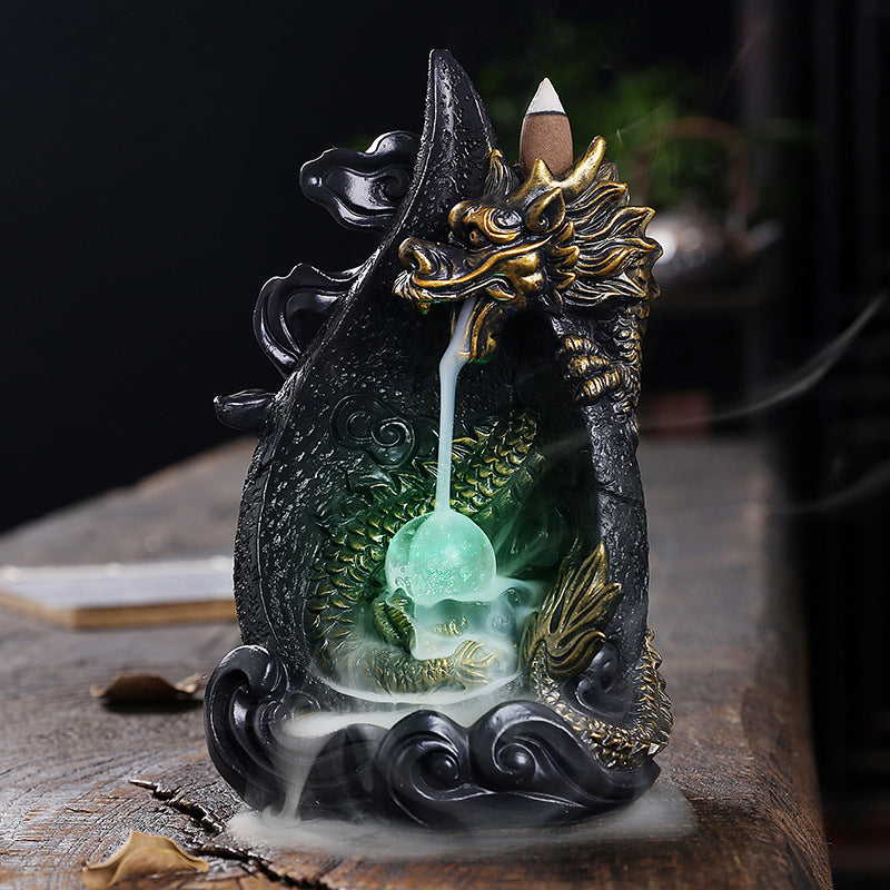 This gorgeous LED Backflow Dragon Incense Burner is handcrafted to instantly add a beautiful, illuminated touch of elegance to your home. Enjoy stunning visual displays while creating a calming atmosphere.