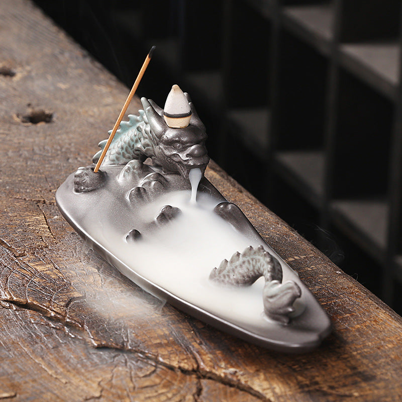Create a soothing and relaxing ambiance with our Ceramic Aromatherapy Dragon Backflow Burner. This beautifully crafted burner not only adds a touch of elegance, but also helps to purify the air and promote a sense of calm with its backflow feature. Perfect for any home or office space.