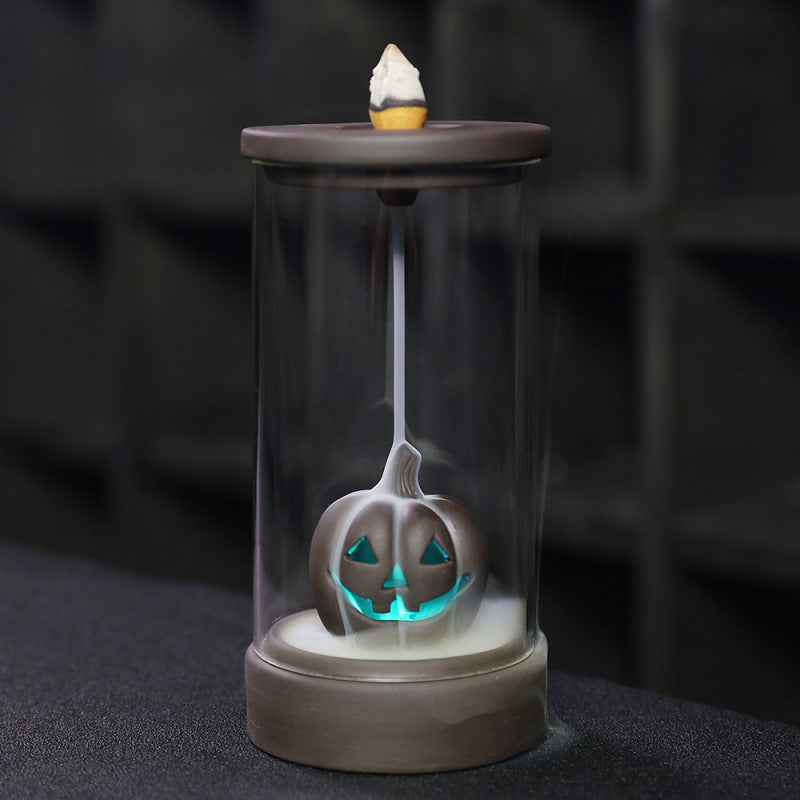 Elevate your Halloween ambiance with the Halloween Pumpkin Backflow Incense Burner. Crafted to create a mesmerizing smoke waterfall effect, it transforms your favorite incense cones into a captivating display.