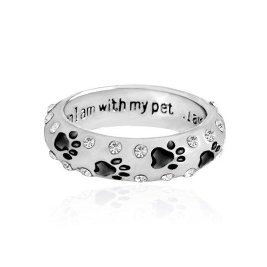 Capture the heartwarming bond between you and your furry best friend with our Dog Paw Prints Jewels Ring. This beautifully crafted ring features delicate paw prints, representing the unbreakable connection between you and your beloved dog. A must-have for any dog lover, this ring makes the perfect accessory to express your love and devotion.