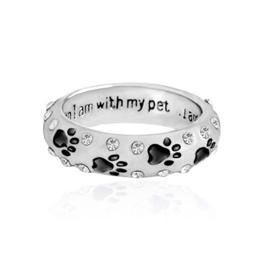 Capture the heartwarming bond between you and your furry best friend with our Dog Paw Prints Jewels Ring. This beautifully crafted ring features delicate paw prints, representing the unbreakable connection between you and your beloved dog. A must-have for any dog lover, this ring makes the perfect accessory to express your love and devotion.