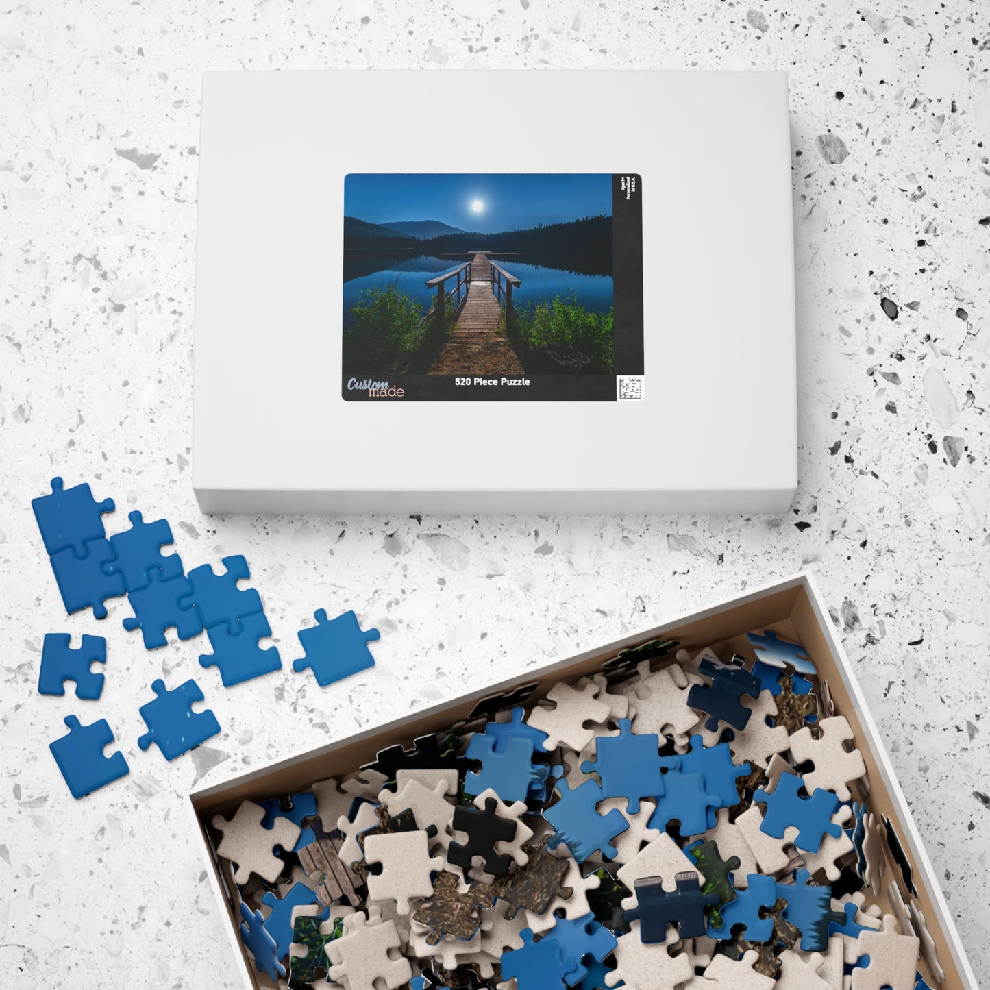 Experience the calming beauty of the Blue Moon At The Lake Puzzle. With 110 to 1014 pieces, this puzzle is perfect for all levels. Immerse yourself in the artistry of the blue moon reflecting on the serene lake, and feel the peace and tranquility it brings. A delightful challenge for any puzzle enthusiast.