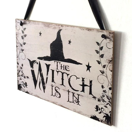 Fly away to the dark side of Halloween décor with this enchanting "The Witch Is In" rustic wooden plaque! This quirky decoration is sure to spark conversations and cast a spell over trick-or-treaters. Come, come! The Witch Is In! On the back side it says "Out of Candy".