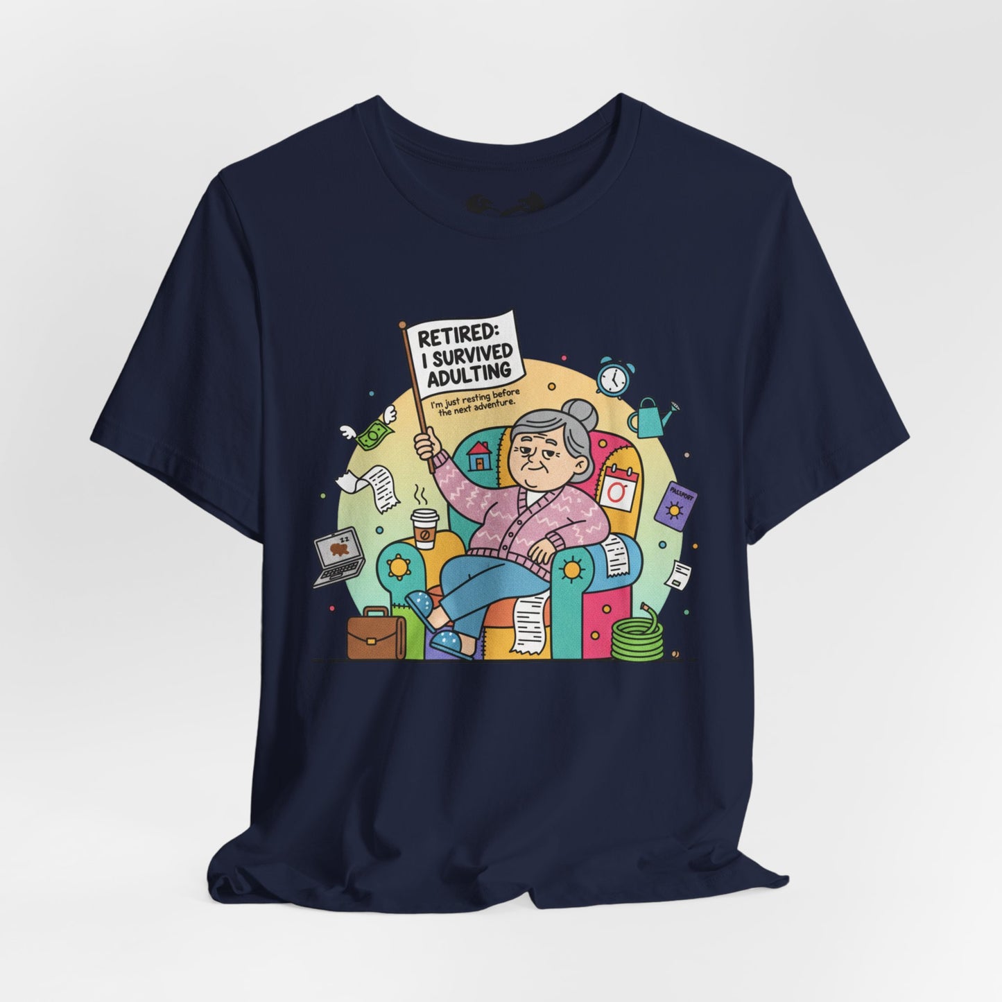 Black t-shirt with a colorful graphic of an elderly woman holding a 'Retired: I Survived Adulting' sign on a white background.