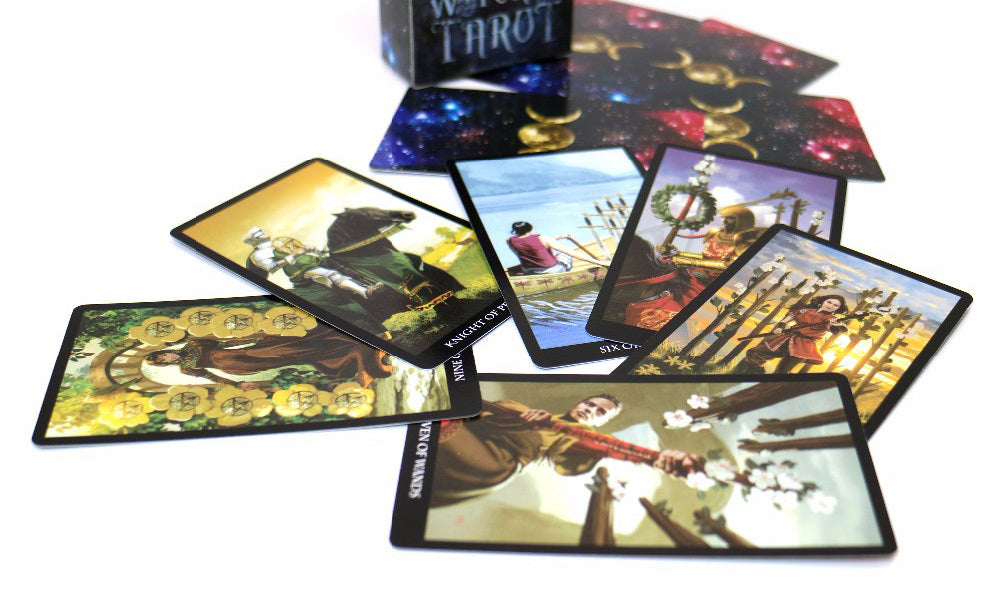 Set of tarot cards with colorful designs on a white background
