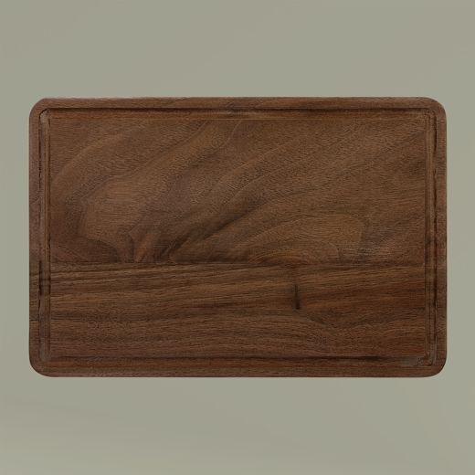 Wooden cutting board on a beige background