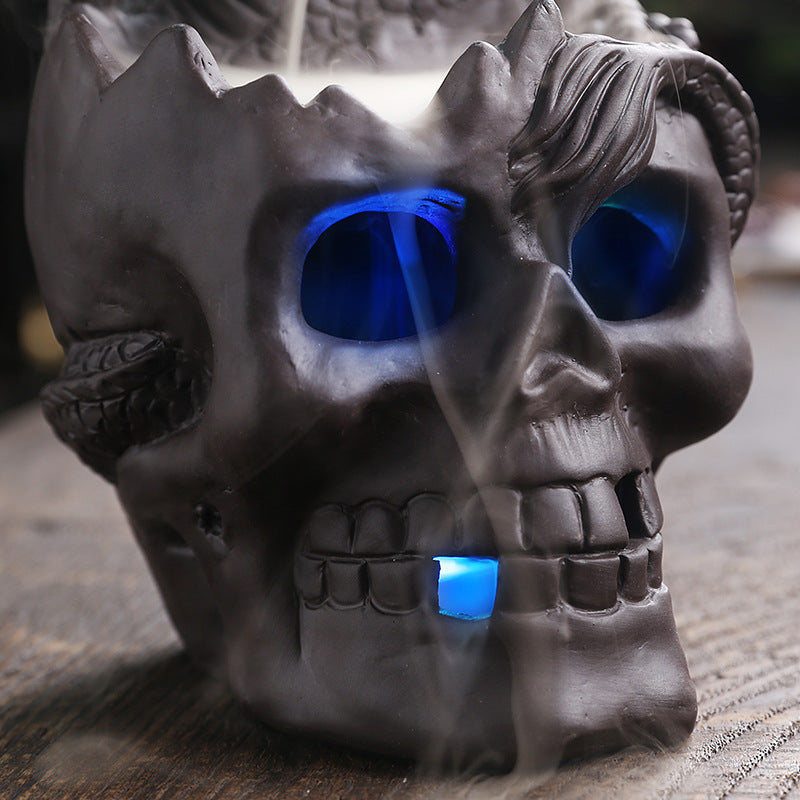 Elevate your space with the Aromatherapy Skull Dragon Backflow Incense Burner. This striking piece combines dramatic skull and dragon motifs to create a captivating focal point.