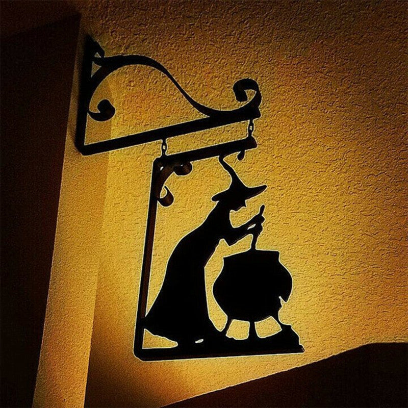 Bring a little magic to your home with this Witch & Cauldron Metal Wall Art. This artistic piece depicts a witch stirring her cauldron, creating something enchanting and sure to bring a unique atmosphere to any area it hangs.