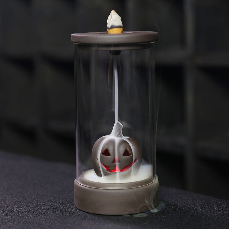 Elevate your Halloween ambiance with the Halloween Pumpkin Backflow Incense Burner. Crafted to create a mesmerizing smoke waterfall effect, it transforms your favorite incense cones into a captivating display.