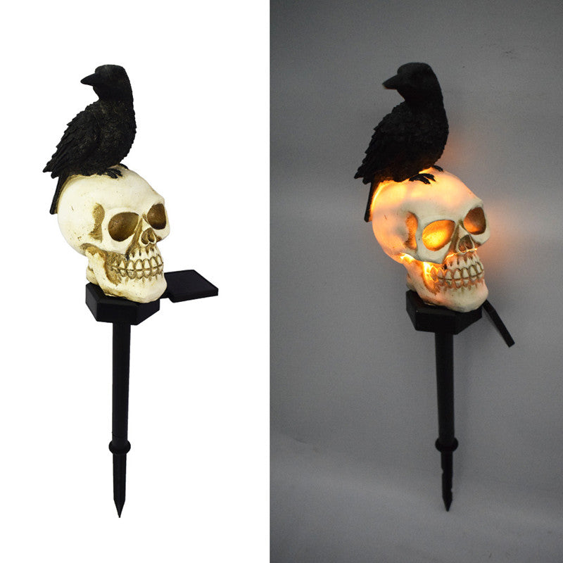 Illuminate your outdoor space with the daring Raven on Skull Solar Yard Lighting. This striking light features a raven perched atop a skull, casting an eerie glow powered by solar energy.