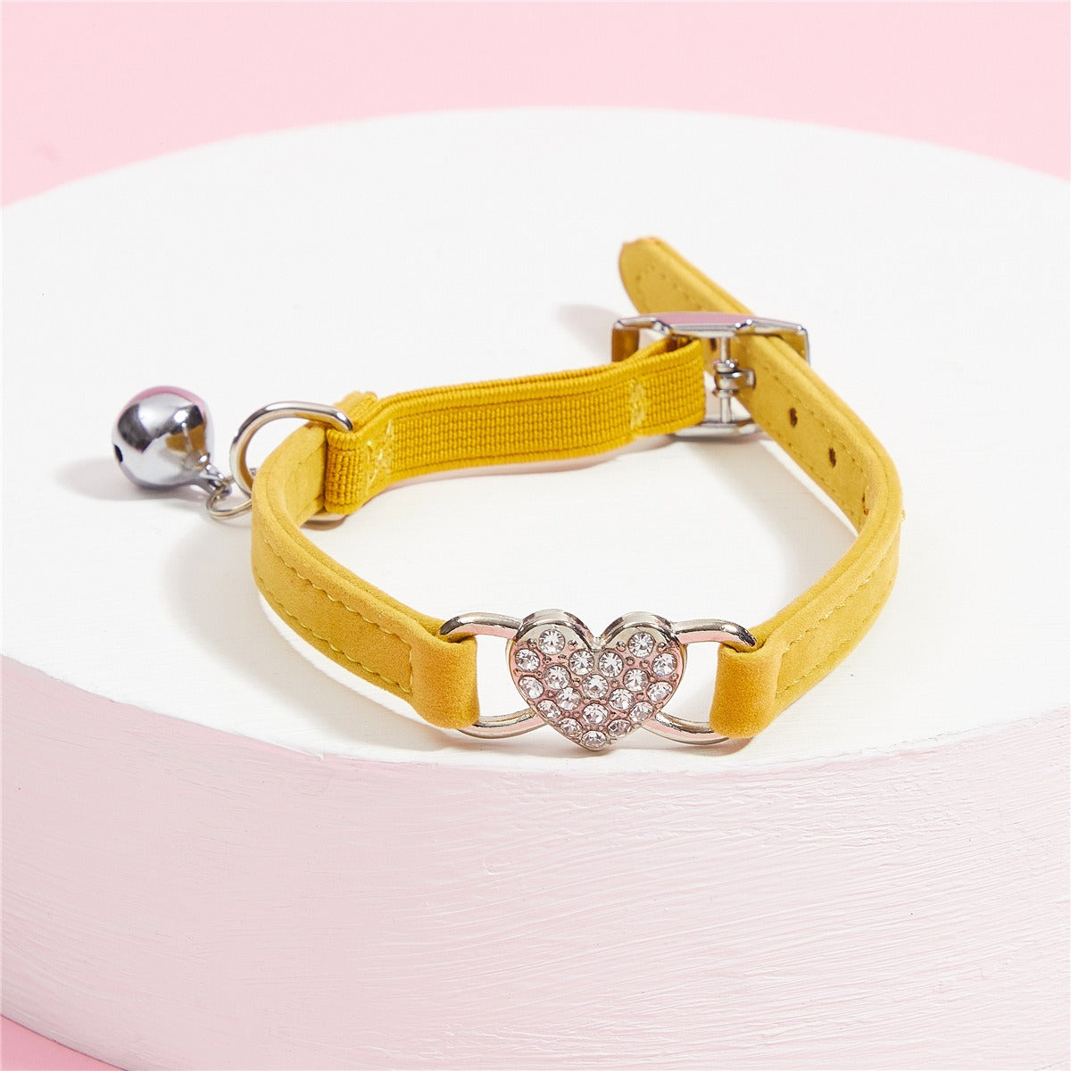 Elevate your furry friend's style with our Medium Crystal Heart Pet Collar with Bell! The sparkling crystal heart adds a touch of elegance while the bell ensures their safety. Give your pet the best of both worlds - fashion and functionality.