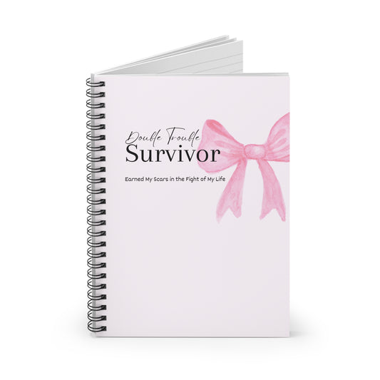 Notebook with a pink bow design and text on a white background