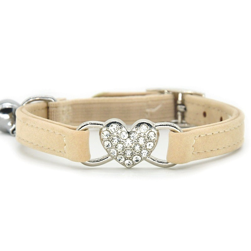 Elevate your furry friend's style with our Medium Crystal Heart Pet Collar with Bell! The sparkling crystal heart adds a touch of elegance while the bell ensures their safety. Give your pet the best of both worlds - fashion and functionality.