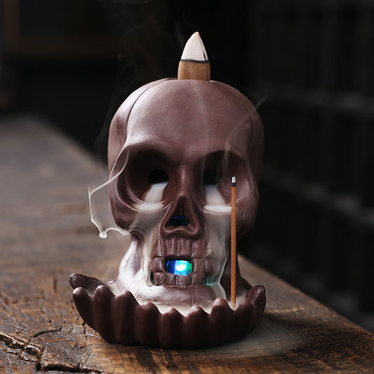 Elevate your space with the Aromatherapy Skull Dragon Backflow Incense Burner. This striking piece combines dramatic skull and dragon motifs to create a captivating focal point.