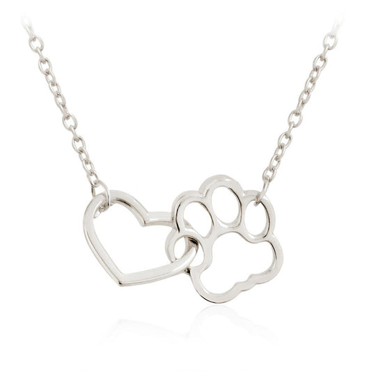 Capture the love and loyalty of your furry friend with our Heart Cat or Dog Footprint Necklace. This beautiful necklace features a heart pendant with a delicate paw print design, reminding you of the unconditional love and companionship of your pet. Show off your love with this unique accessory!