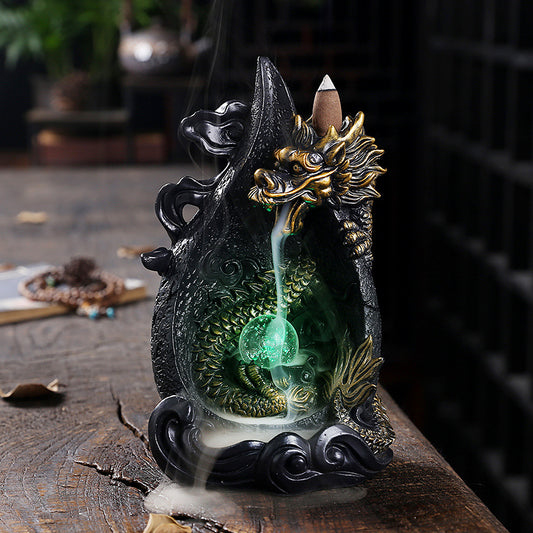 This gorgeous LED Backflow Dragon Incense Burner is handcrafted to instantly add a beautiful, illuminated touch of elegance to your home. Enjoy stunning visual displays while creating a calming atmosphere.