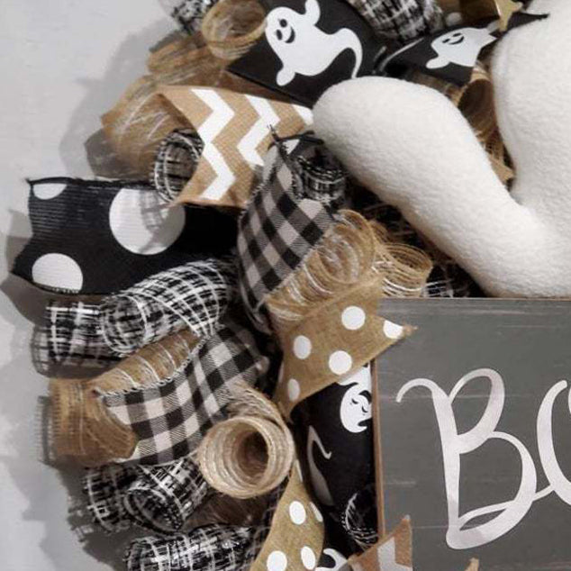 Add a spooky twist to your Halloween decor with this Cute Halloween Ghost Boo Wreath. Featuring playful ghost accents and a bold "Boo" message, it captures the fun and eerie spirit of the season, making your entrance unforgettable.