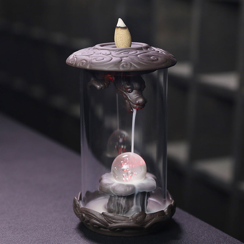 Upgrade your incense game with our Purple Sand Dragon Backflow Incense Burner. This beautiful burner features a unique design that releases a downward flow of smoke, creating a mesmerizing and relaxing ambiance. Perfect for meditation, yoga, or simply unwinding after a long day.