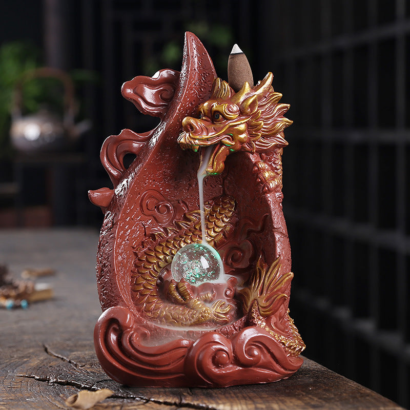 This gorgeous LED Backflow Dragon Incense Burner is handcrafted to instantly add a beautiful, illuminated touch of elegance to your home. Enjoy stunning visual displays while creating a calming atmosphere.