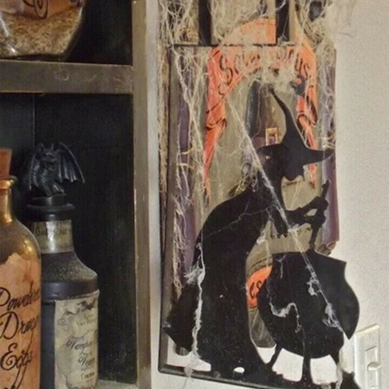 Bring a little magic to your home with this Witch & Cauldron Metal Wall Art. This artistic piece depicts a witch stirring her cauldron, creating something enchanting and sure to bring a unique atmosphere to any area it hangs.