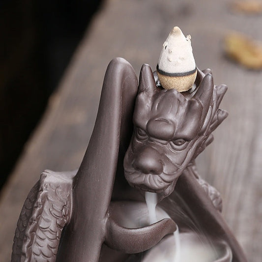 Upgrade your home decor with our Creative Dragon Backflow Incense Burner! Featuring a unique design, it not only adds a touch of elegance to any room but also creates a relaxing and soothing atmosphere with its backflow incense effect. Perfect for those looking for a calming and stylish addition to their space.