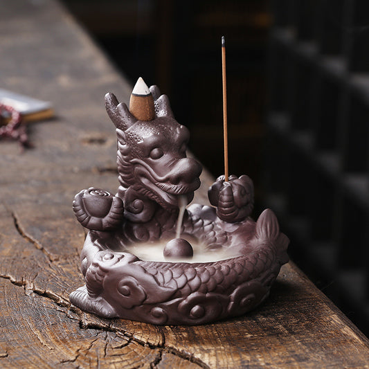 This beautiful Small Dragon Back Flow Incense Burner is a perfect addition to any home. Crafted with intricate details and made from durable material, this incense burner will create an enchanting atmosphere in any room.