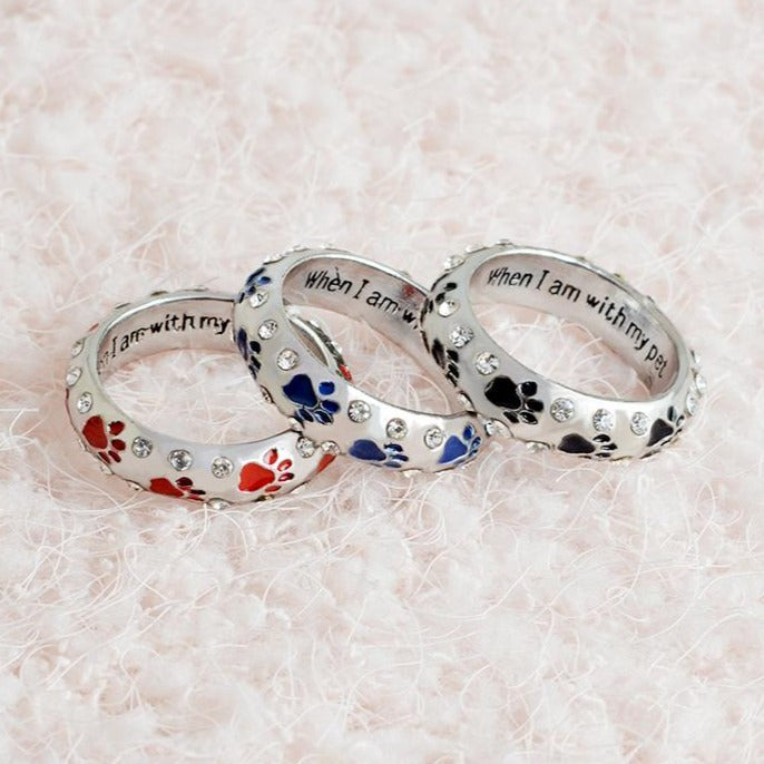 Capture the heartwarming bond between you and your furry best friend with our Dog Paw Prints Jewels Ring. This beautifully crafted ring features delicate paw prints, representing the unbreakable connection between you and your beloved dog. A must-have for any dog lover, this ring makes the perfect accessory to express your love and devotion.
