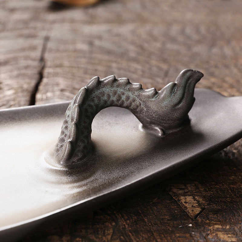 Create a soothing and relaxing ambiance with our Ceramic Aromatherapy Dragon Backflow Burner. This beautifully crafted burner not only adds a touch of elegance, but also helps to purify the air and promote a sense of calm with its backflow feature. Perfect for any home or office space.