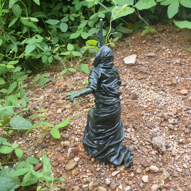 Spook up your garden with this unique hand-painted Grim Reaper sculpture! With its bold and daring design, it will be sure to add an adventurous touch to your Halloween décor.