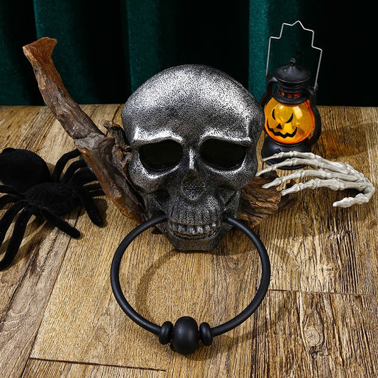 Make a bold statement this Halloween with the Halloween Skull Door Knocker. Crafted to catch attention, this striking decoration adds a spooky touch to your front door while serving as a functional knocker. Its detailed skull design creates an eerie atmosphere that sets the perfect mood for your Halloween festivities.