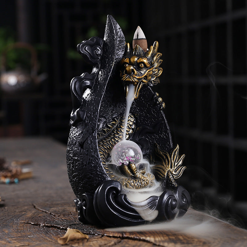 This gorgeous LED Backflow Dragon Incense Burner is handcrafted to instantly add a beautiful, illuminated touch of elegance to your home. Enjoy stunning visual displays while creating a calming atmosphere.