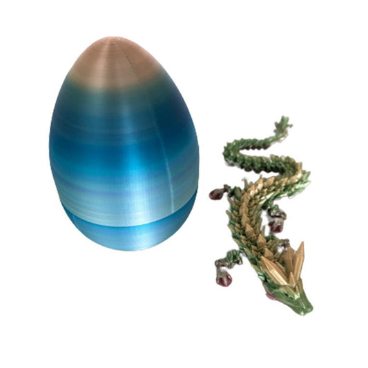 Discover the magic of this 3D Printed Moveable Dragon in Egg, a unique collectible that combines intricate design with fascinating movement. Crafted with precision, this dragon springs to life within its egg, making it a captivating display piece.